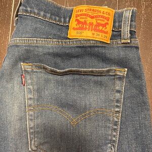 Levi 505 36x29. Regular.   Dark wash. Low stretch.